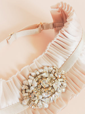 Mamie + James Charlotte silk charmeuse adjustable wedding garter with nude stretch banding and antique rose silk charmeuse with rhinestone appliqué in a gold tone setting